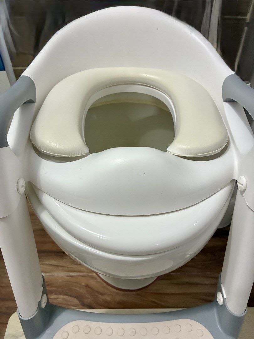 Foldable Adjustable Potty Training Seat with Step Stool (Category: Toilet Training) located in Quezon City. Submitted by inmycloset03 (Listing ID 1450664840, Image 3). Description: - Adjustable seat for a secure fit on standard toilets - Built-in step stool for easy, independent climbing - Handles provide extra support and confidence - Easy to clean and maintain - Ideal for transitioning from diapers to the toilet.
