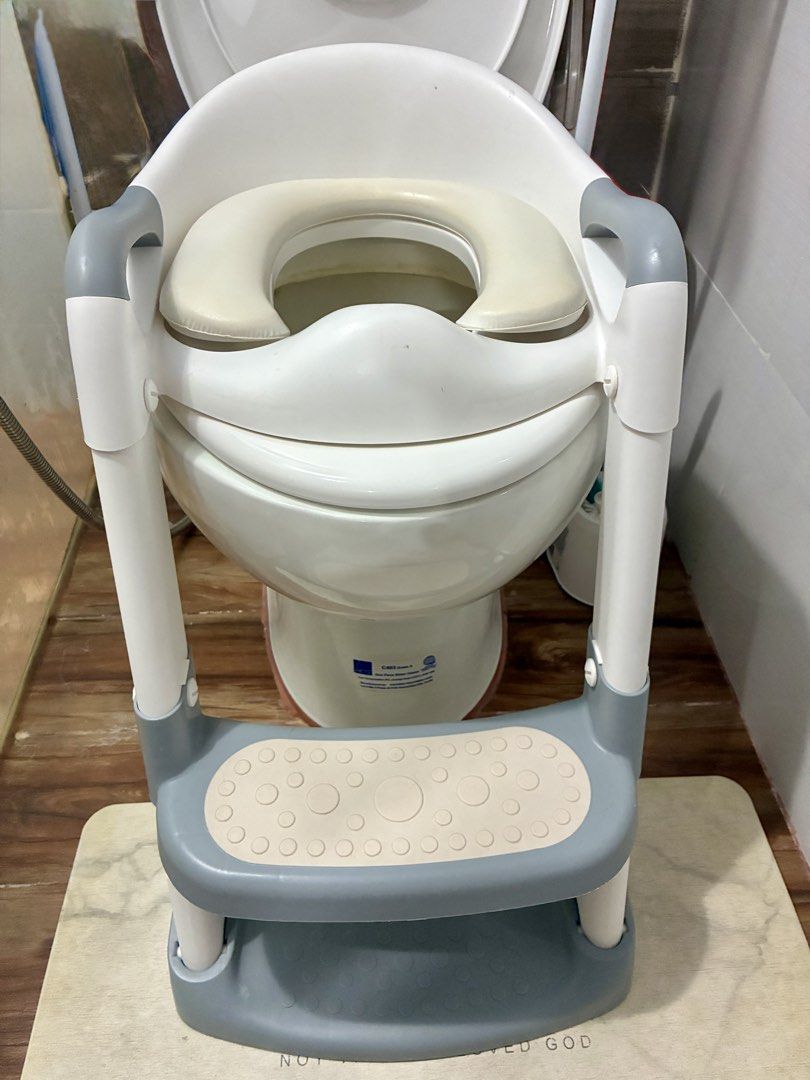 Foldable Adjustable Potty Training Seat with Step Stool (Category: Toilet Training) located in Quezon City. Submitted by inmycloset03 (Listing ID 1450664840, Image 1). Description: - Adjustable seat for a secure fit on standard toilets - Built-in step stool for easy, independent climbing - Handles provide extra support and confidence - Easy to clean and maintain - Ideal for transitioning from diapers to the toilet.