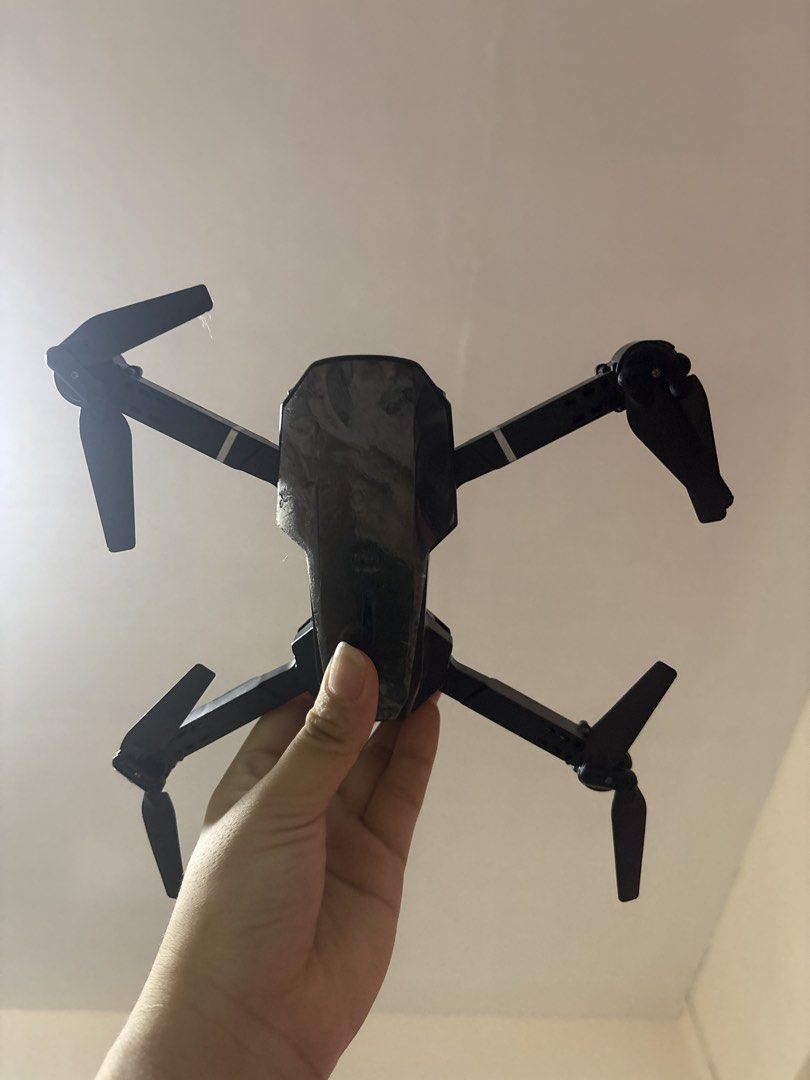 Folding Drone with Remote Controller and Case (Category: Drones) located in Quezon City. Submitted by lottiebunny (Listing ID 1450665043, Image 2). Description: - Black folding drone - Includes remote controller and charging cables - Comes in a protective case for easy carrying - Ideal for beginners - User manual included.