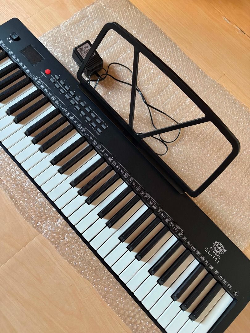 Global GL-111 Digital\ Electronic Piano\ Keyboard Compact Sized 61 Keys (Category: Musical Instruments) located in San Luis. Submitted by blutey (Listing ID 1450665108, Image 1). Description: Bought but never used, complete and in excellent condition. Handy \ Compact Sized Keyboard > 61 Keys Percussion >256 Timbres and 256 Rhythms > Rhythm, Cord Volume Control > Single Finger Cord, Multi - Finger Cord > Demonstration and Learning Functions > Spli