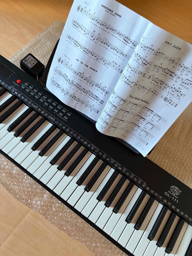 Global GL-111 Digital\ Electronic Piano\ Keyboard Compact Sized 61 Keys (Category: Musical Instruments) located in San Luis. Submitted by blutey (Listing ID 1450665108, Image 2). Description: Bought but never used, complete and in excellent condition. Handy \ Compact Sized Keyboard > 61 Keys Percussion >256 Timbres and 256 Rhythms > Rhythm, Cord Volume Control > Single Finger Cord, Multi - Finger Cord > Demonstration and Learning Functions > Spli