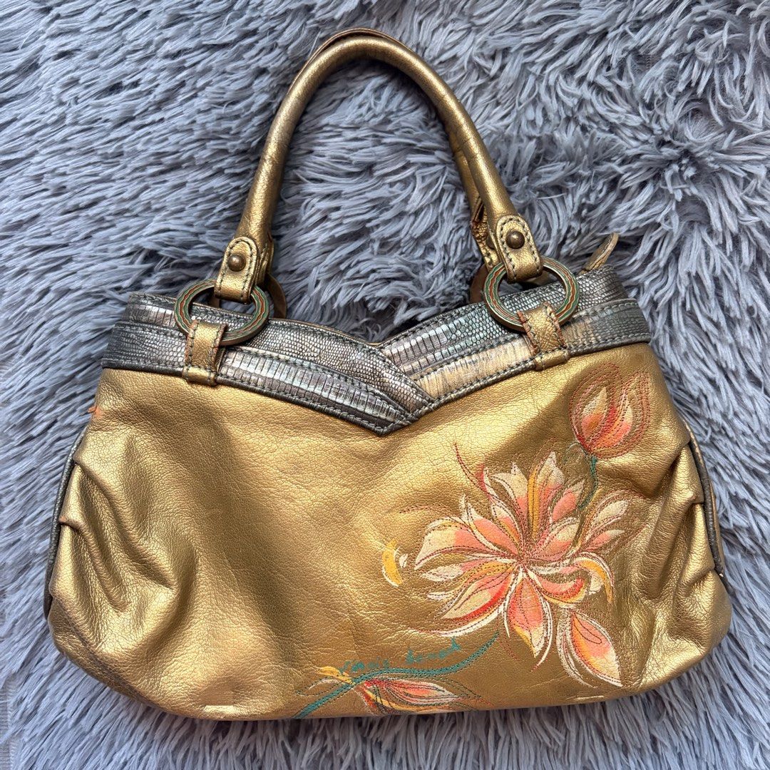 Gold Metallic Handbag with Floral Design (Category: Luxury Bags & Wallets) located in Iloilo. Submitted by faerysha_ (Listing ID 1450549802, Image 1). Description: .