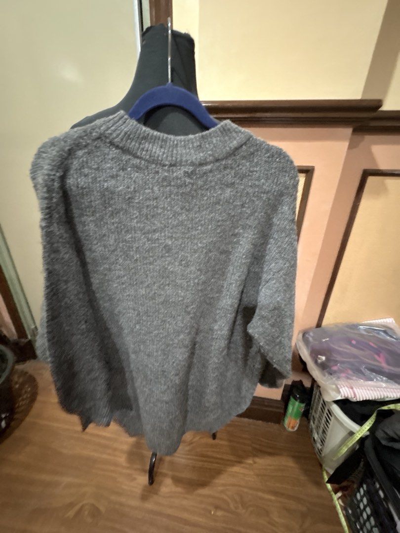 Grey Ribbed Knit Mock Neck Sweater (Category: Coats, Jackets and Outerwear) located in Manila. Submitted by dig76 (Listing ID 1450604282, Image 2). Description: H&M Given as a gift. No tag - Cozy grey sweater - Ribbed knit texture - Mock neck design - Relaxed fit - Ideal for layering or wearing solo - Versatile: pairs well with jeans or skirts.