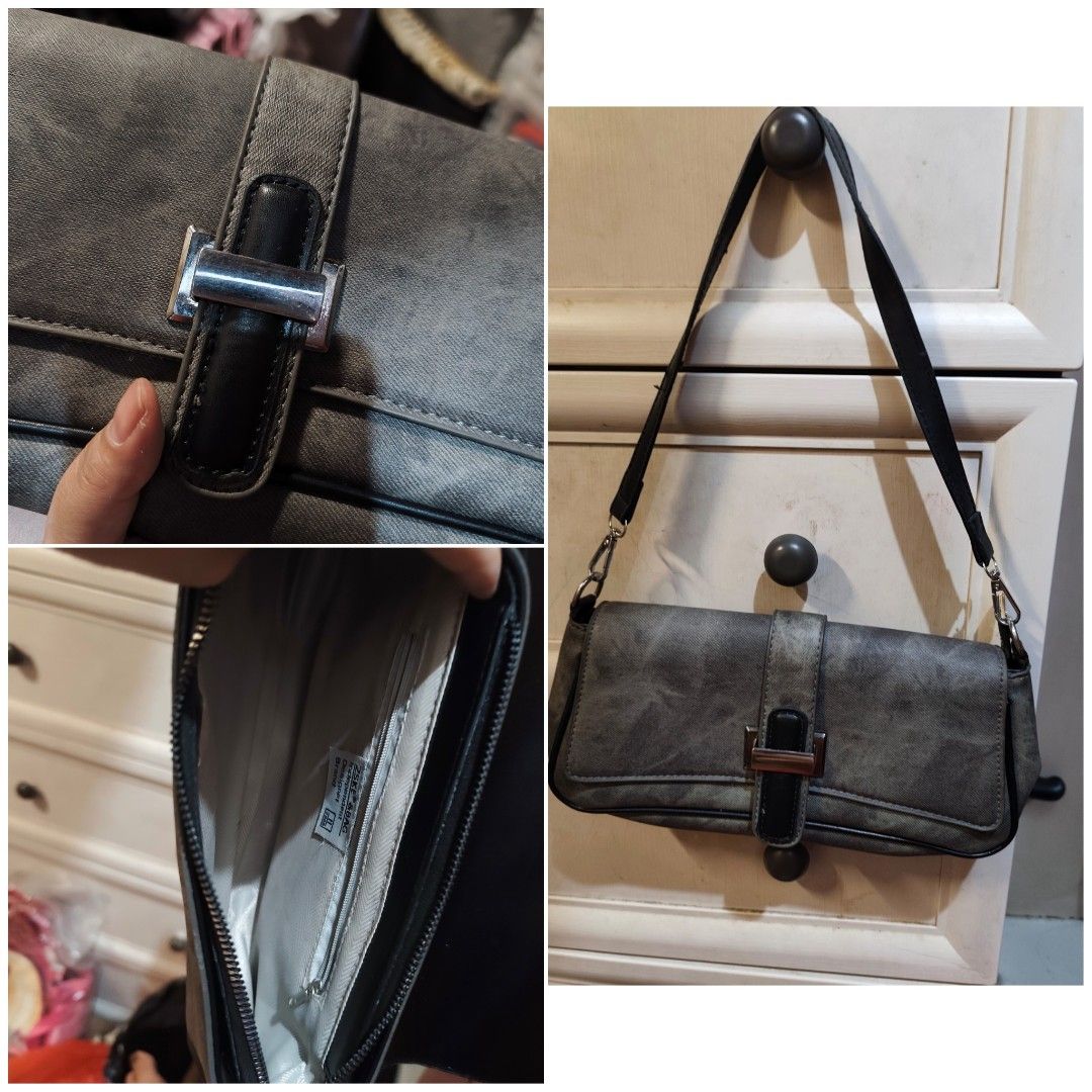 Grey Shoulder Bag with Buckle Detail (Category: Shoulder Bags) located in Makati City. Submitted by ainayabs (Listing ID 1450580233, Image 1). Description: - Stylish grey shoulder bag - Unique buckle closure on the front - Slightly distressed material for a trendy look - Interior compartments for easy organization - Adjustable strap for comfortable wear - Ideal for everyday use.