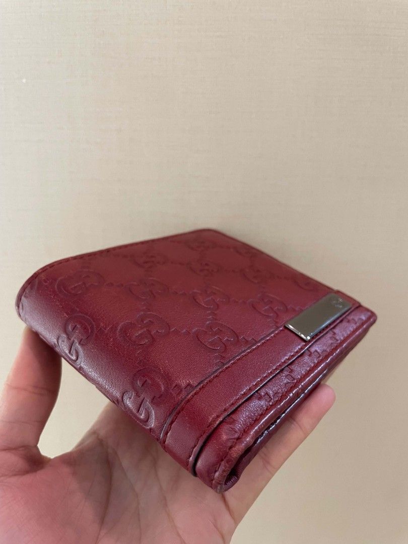 Gucci Guccisima Red Monogram Bi-fold Wallet (Category: Luxury Bags & Wallets) located in Plaridel. Submitted by collectors_blocc (Listing ID 1450596326, Image 2). Description: - Authentic red Gucci bi-fold wallet - Classic GG monogram embossed all over - Metal accent on the front - Ample space for cards and cash - Ideal for everyday use.
