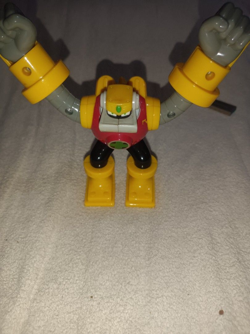 Gutsman From Megaman (Category: Figurines & Statues) located in Antipolo. Submitted by guinevere.asamiya (Listing ID 1450537365, Image 1). Description: - Classic action figure style robot toy - Vibrant yellow and red color scheme - Poseable arms for dynamic display - Perfect for robot-loving kids and collectors - Shows minor scuffs from play (please check photos for condition).