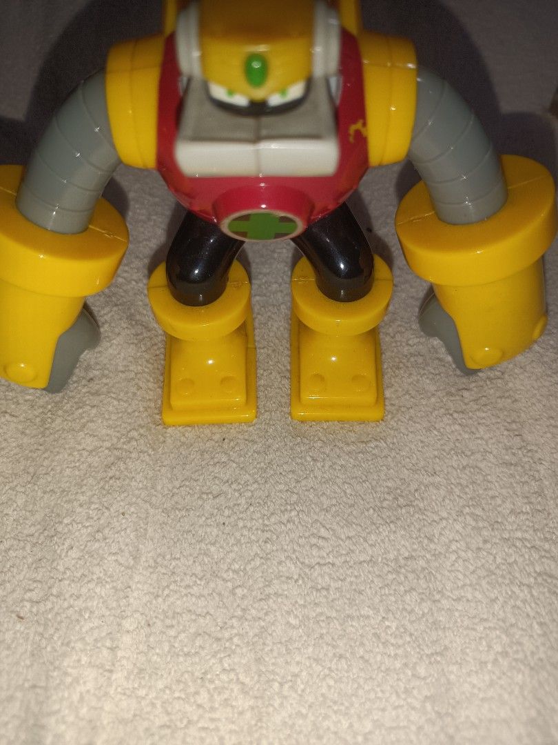 Gutsman From Megaman (Category: Figurines & Statues) located in Antipolo. Submitted by guinevere.asamiya (Listing ID 1450537365, Image 2). Description: - Classic action figure style robot toy - Vibrant yellow and red color scheme - Poseable arms for dynamic display - Perfect for robot-loving kids and collectors - Shows minor scuffs from play (please check photos for condition).