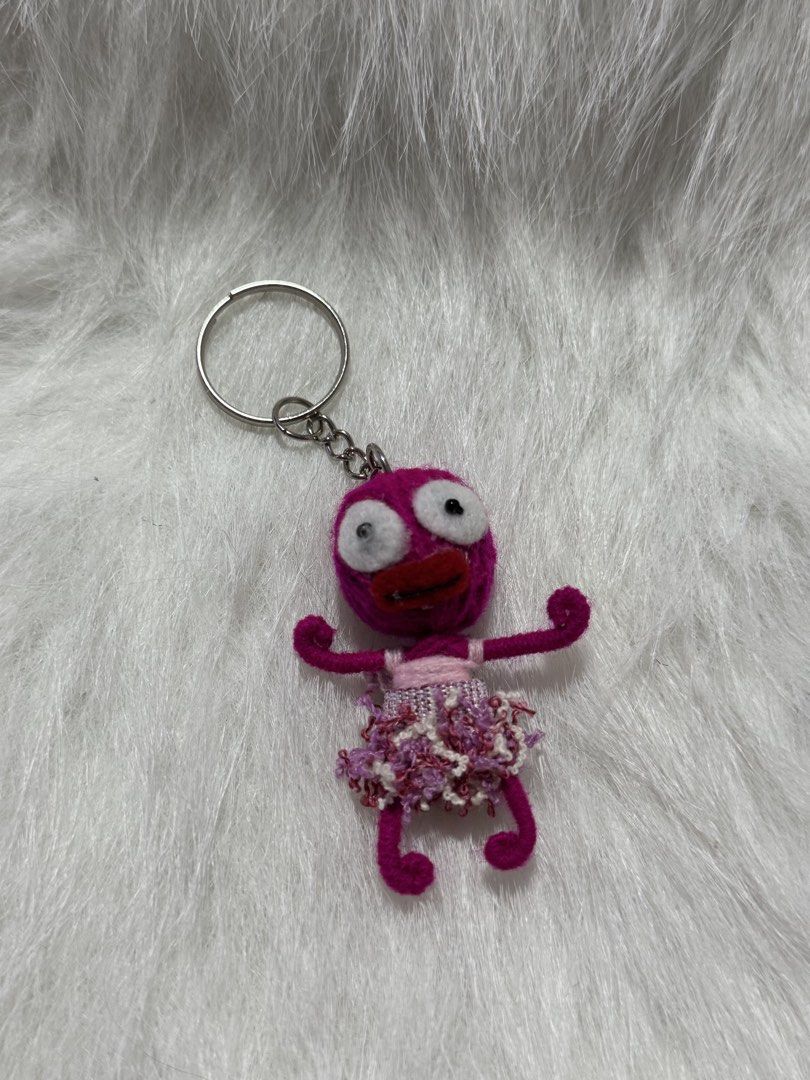 handmade pink string voodoo doll keychain, designed as a good luck charm (Category: Handmade Craft) located in Angeles City. Submitted by zyeplustradings (Listing ID 1450732908, Image 1). Description: handmade pink string voodoo doll keychain, designed as a good luck charm. It is approximately 7cm in size and features a unique character design with a dress..