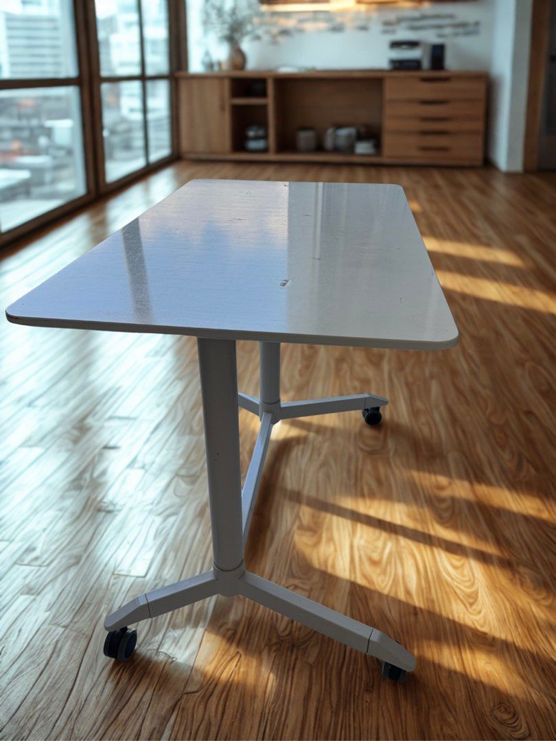 Height Adjustable Table (Category: Tables & Sets) located in Singapore. Submitted by wondersbywonders (Listing ID 1450545310, Image 2). Description: Office/Study table that can adjust height White and with wheels that can easily move around Table size: 100cm (L) x 60cm (D) x 175cm (H) / 80cm (H).