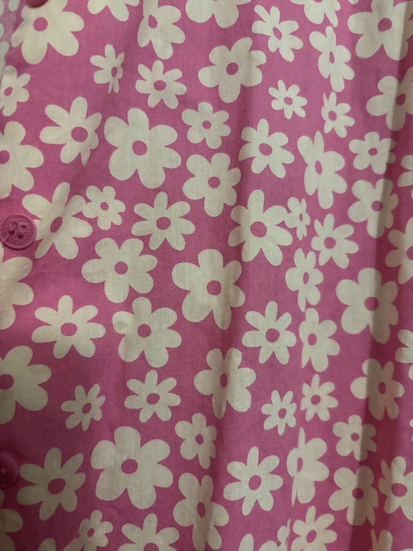 H&M Pink Floral Short Sleeve Button Up Shirt (Category: Other Tops) located in Shah Alam. Submitted by by.mei (Listing ID 1450646008, Image 3). Description: - Pink short sleeve shirt - Adorable all-over white daisy print - Classic button-up style with collar - Relaxed fit for comfort - Versatile for casual outfits or layering - Pairs well with jeans or shorts.