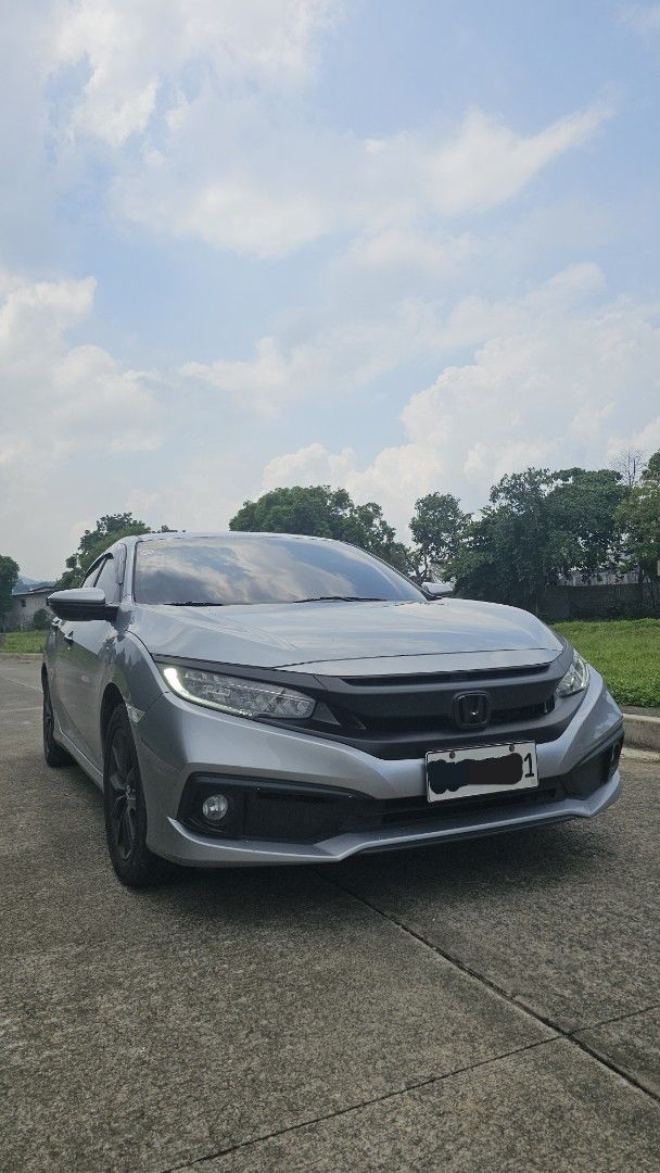 Honda Civic 1.8 (A) (Category: Used Cars) located in Mandaluyong City. Submitted by vicdahon (Listing ID 1450553399, Image 3). Description: 1.8 E CVT w/ 2 keys Casa PMS maintained 68kms Monday coding w/ Spoiler but not drilled, 3M attached only w/ Chrome delete wrap (remove if you want, emblem & garnish are protected) 100% not flooded Stock mags but painted professionally to black Negotiable for sure buyer! Message for viewing at SMDC Light 2 nea