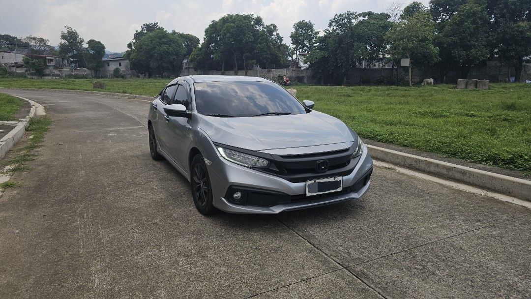 Honda Civic 1.8 (A) (Category: Used Cars) located in Mandaluyong City. Submitted by vicdahon (Listing ID 1450553399, Image 2). Description: 1.8 E CVT w/ 2 keys Casa PMS maintained 68kms Monday coding w/ Spoiler but not drilled, 3M attached only w/ Chrome delete wrap (remove if you want, emblem & garnish are protected) 100% not flooded Stock mags but painted professionally to black Negotiable for sure buyer! Message for viewing at SMDC Light 2 nea