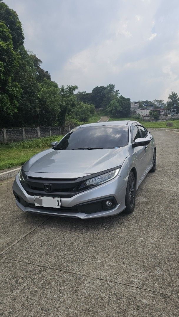 Honda Civic 1.8 (A) (Category: Used Cars) located in Mandaluyong City. Submitted by vicdahon (Listing ID 1450553399, Image 1). Description: 1.8 E CVT w/ 2 keys Casa PMS maintained 68kms Monday coding w/ Spoiler but not drilled, 3M attached only w/ Chrome delete wrap (remove if you want, emblem & garnish are protected) 100% not flooded Stock mags but painted professionally to black Negotiable for sure buyer! Message for viewing at SMDC Light 2 nea