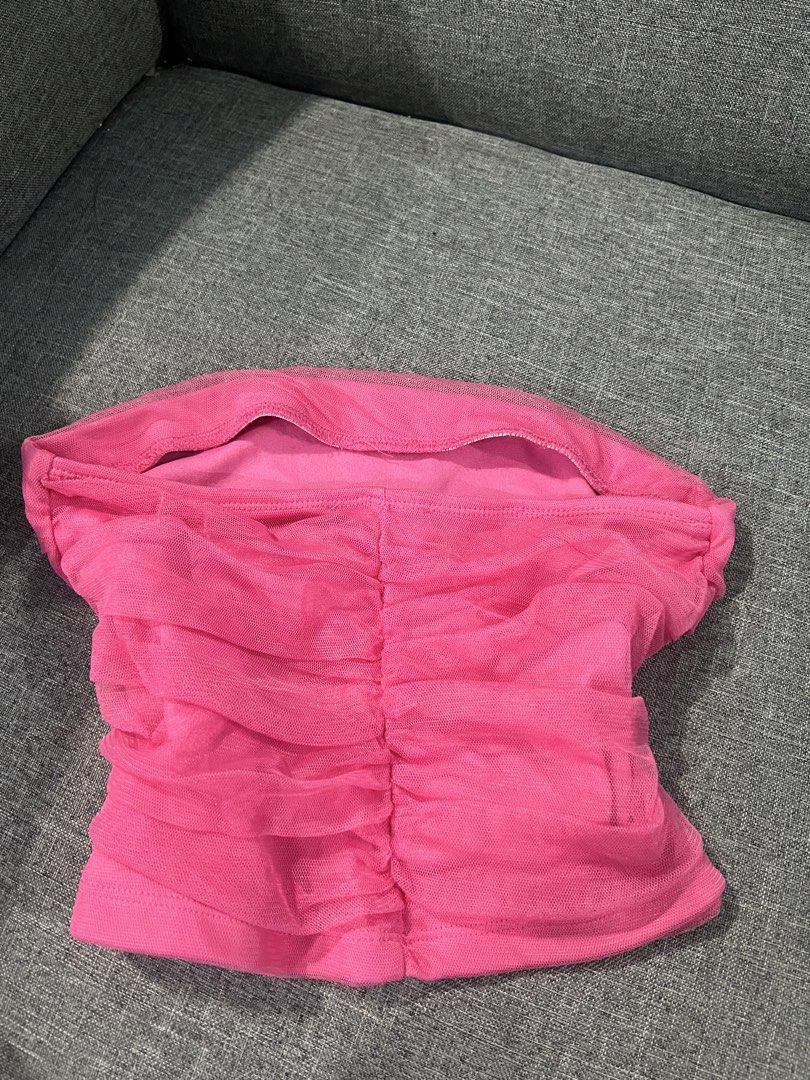 Hot Pink Ruched Mesh Tube Top (Category: Others Tops) located in Manila. Submitted by pmuffy24 (Listing ID 1450719165, Image 2). Description: - Super cute hot pink tube top - Features a ruched mesh overlay - Stretchy material for a comfortable fit - Perfect for a night out or party look - Versatile: easily pairs with jeans or a skirt - You'll love the unique texture and vibrant color.