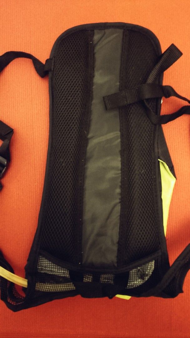 Hydration Backpack with 2L Water Bladder (Category: Backpacks) located in Binan City. Submitted by ollkorrect (Listing ID 1450643093, Image 2). Description: - Black hydration backpack with vibrant neon green accents. - Features a breathable mesh back panel for comfort. - Comes complete with a water bladder and drinking tube. - Ideal for cycling, hiking, running, and other outdoor activities. - Lightweight yet durable construction. - Brand new wit
