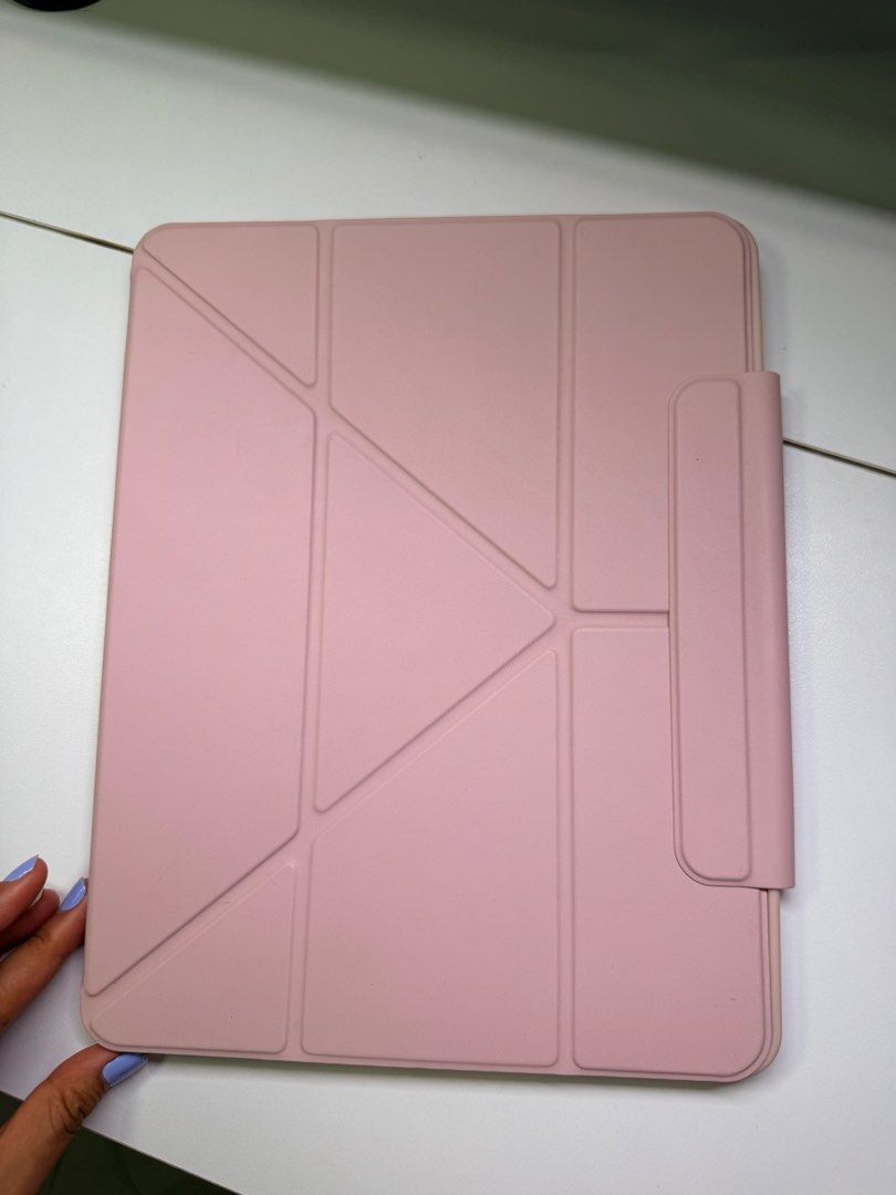 Ipad pro 12.9in case (Category: Cases & Sleeves) located in Cavite. Submitted by jamalinao (Listing ID 1450640787, Image 1). Description: - Pink case designed for iPad Pro 12.9-inch - Features a versatile origami stand for various viewing angles - Includes a convenient holder for your Apple Pencil - Soft interior lining to protect your device -Please take note of the stain at the back of the case.