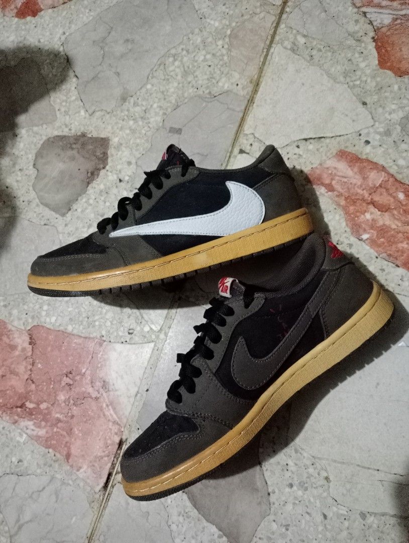 Jordan 1 Retro Low OG SP (Category: Casual Shoes) located in Manila. Submitted by hanl7584 (Listing ID 1450679745, Image 1). Description: Air Jordan 1 High Travis Scott, La Flame added his signature backwards Swoosh logo on the lateral side. "Cactus Jack" insignias on the heel and inner upper atopa sail midsole and dark brown outsole completes the design. EU 40½ Colorway Black/Dark Mocha-University Red-Sail -Slightly used dipa pudpod outsole RFS: