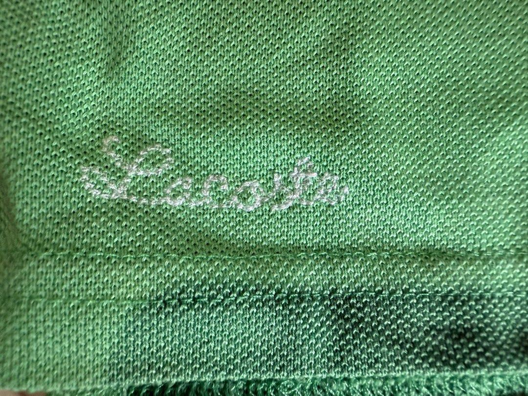 Lacoste Green Polo Shirt Size 14 (Category: Tshirts & Polo Shirts ) located in Caloocan City. Submitted by mochibolala13 (Listing ID 1432059657, Image 3). Description: Authentic Lacoste polo shirt in a refreshing green color. Features the iconic Lacoste crocodile logo on the chest. Made in Peru, designed in France. Size 14. Made of 100% cotton. The shirt has a classic polo collar and short sleeves with white trim..