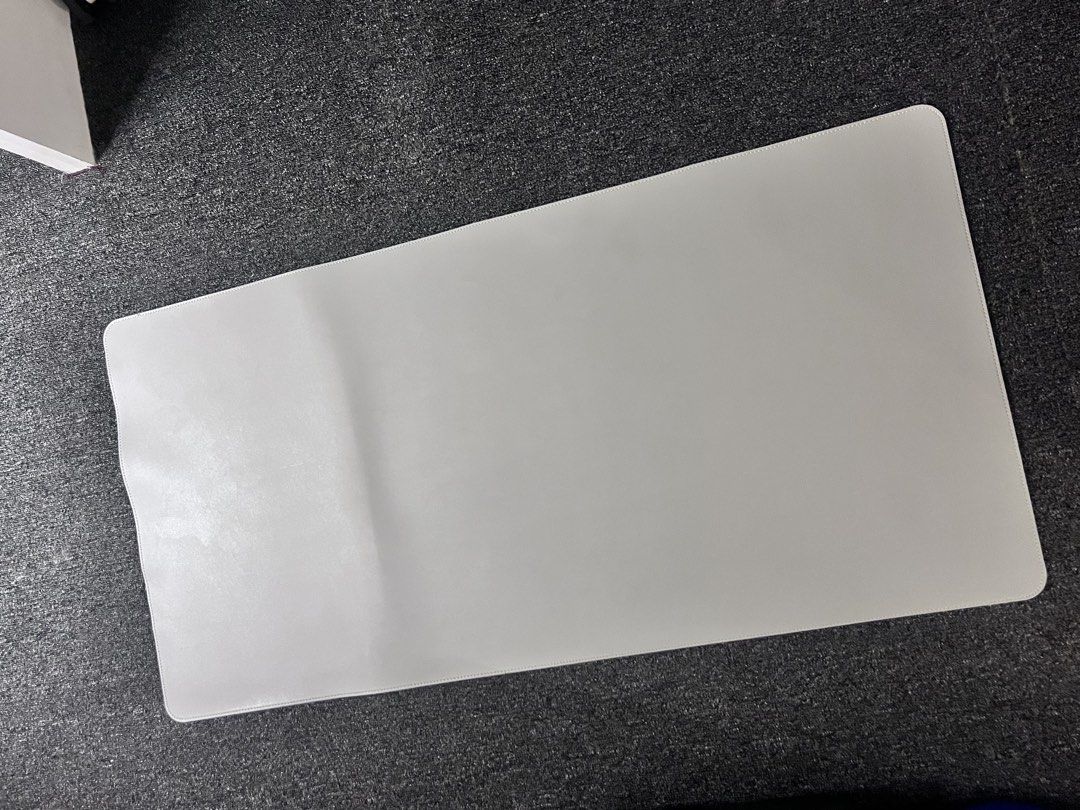 Large White Desk Mat / Mouse Pad (Category: Mouse & Mousepads) located in Manila. Submitted by sevora (Listing ID 1450705540, Image 1). Description: - Generous size for keyboard and mouse - Smooth surface for optimal tracking - Easy to wipe clean - Helps organize your workspace - Protects your desk from scratches - Clean, minimalist design Color: light gray.