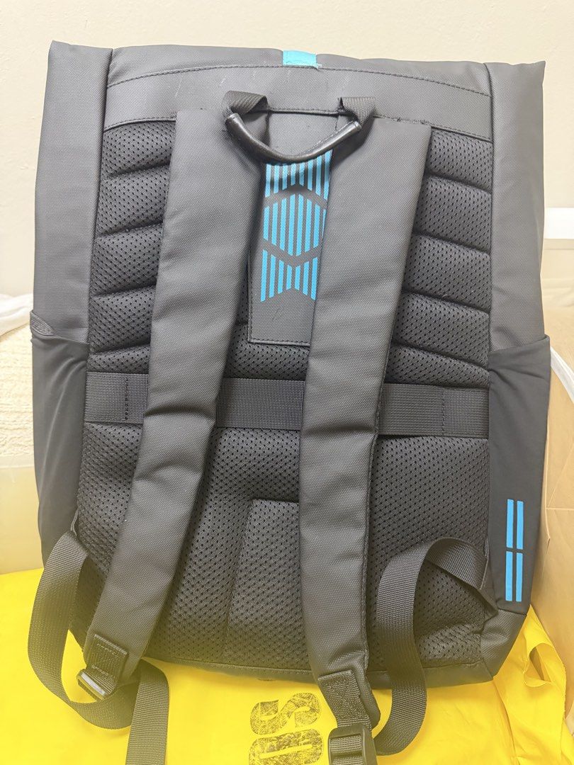 Lenovo Ideapad Gaming Backpack (Category: Backpacks) located in Pasig City. Submitted by jenrosesteller (Listing ID 1450725836, Image 3). Description: - Stylish black backpack with blue accents - Features 'Ideapad Gaming' print on the front - Secure roll-top closure with buckle - Comfortable padded straps and back panel - Convenient side pockets for water bottles or accessories - Ideal for carrying laptops and gaming gear.