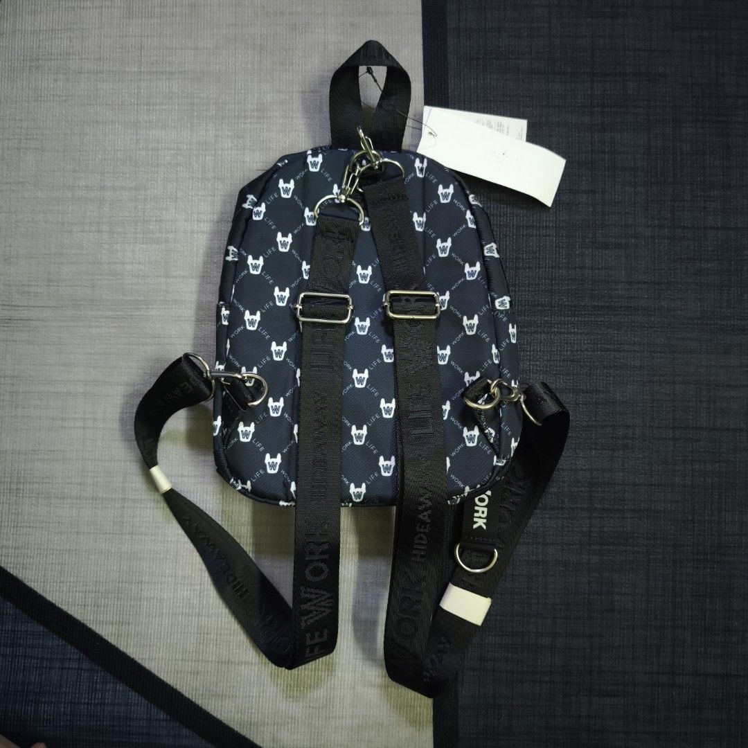 LIFEWORK Monogram Mini Backpack (Category: Backpacks) located in Cheras. Submitted by hypestandard (Listing ID 1450717394, Image 2). Description: - LIFEWORK Monogram Mini Backpack - Black Colour - Measurements 20cm (w) x 27cm (h) x 7.5cm (d) - Front patch of a French bulldog face - Main zip compartment - Smaller front zip pocket - Adjustable straps - Comes with 'LIFEWORK' tag - Ideal for everyday use or travel.