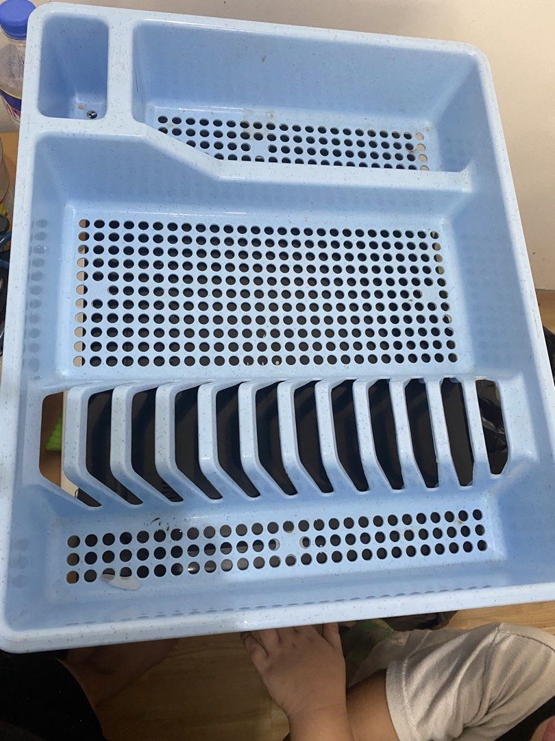 Light Blue Plastic Dish Rack with Utensil Holder (Category: Food Organization & Storage) located in Las Pinas. Submitted by allaroundseller (Listing ID 1450646696, Image 1). Description: - Light blue plastic dish rack - Slots for plates and cups - Separate section for cutlery - Effective water drainage - Ideal for organizing kitchen sink area - Minor signs of use, but fully functional - Ready for a new home.