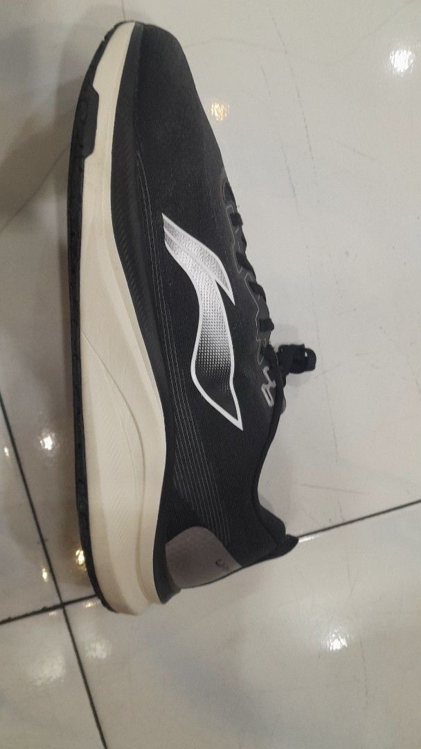 Li-Ning Running Shoes Black (Category: Sneakers) located in Subic. Submitted by adamdwyane (Listing ID 1450609772, Image 2). Description: - Black Li-Ning running shoes - Breathable mesh upper - White midsole with black outsole - Excellent sole grip - Secure lace-up closure - Ideal for running and workouts.
