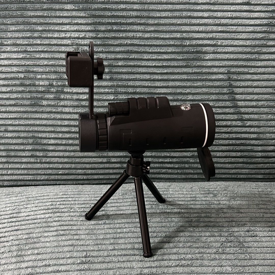 Monocular Telescope with Tripod and Phone Mount (Category: Tripods & Monopods) located in Cavite. Submitted by _schmyla (Listing ID 1450608818, Image 2). Description: - Black monocular telescope - Includes mini tripod and phone mount attachment - Ideal for bird watching and stargazing - Compact and portable design - Lens cap included - Easy to set up and use.