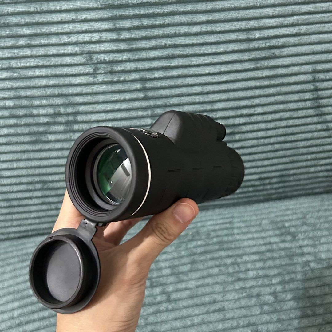 Monocular Telescope with Tripod and Phone Mount (Category: Tripods & Monopods) located in Cavite. Submitted by _schmyla (Listing ID 1450608818, Image 3). Description: - Black monocular telescope - Includes mini tripod and phone mount attachment - Ideal for bird watching and stargazing - Compact and portable design - Lens cap included - Easy to set up and use.