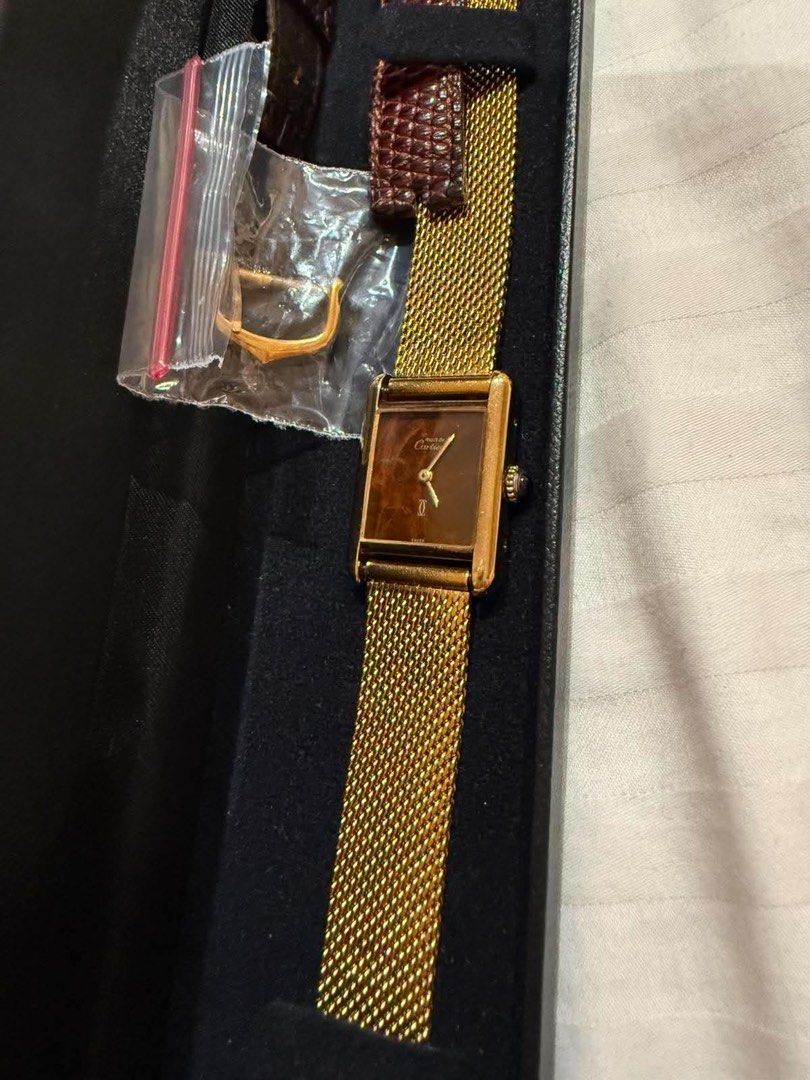 Cartier Tank (Category: Luxury Watches) located in Taguig. Submitted by consumergoodstrading (Listing ID 1450649706, Image 1). Description: Must de Cartier Tank Dial: Rare brown lacquer (“wood grain” or “tortoise”) dial Watch only 1970s For More Information Pm me Thank you .