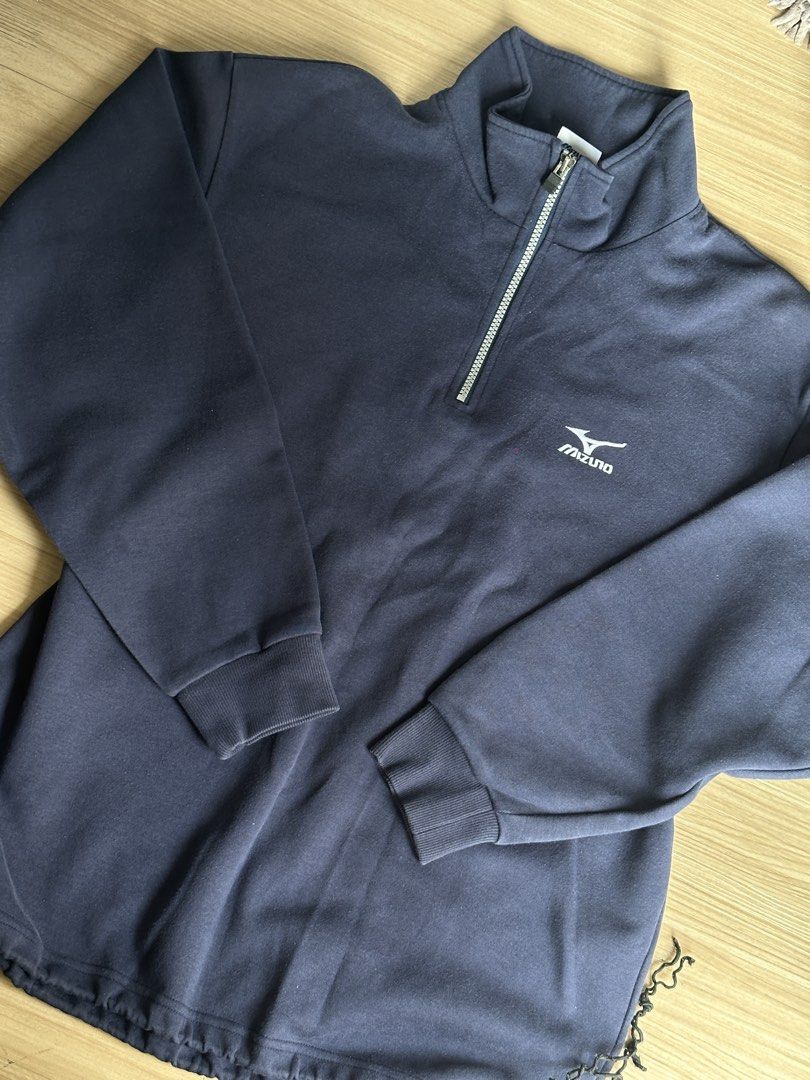 Navy Mizuno Quarter Zip Sweatshirt (Category: Coats, Jackets and Outerwear) located in Quezon City. Submitted by prelovednd21 (Listing ID 1450607076, Image 2). Description: - Navy blue Mizuno sweatshirt - Quarter zip neckline with silver zipper - Mizuno logo on chest - Ribbed cuffs and hem - Drawstring at bottom hem - Ideal for casual wear or sports (Issue yung tali sa baba naputol pero steal parin (see last pic).