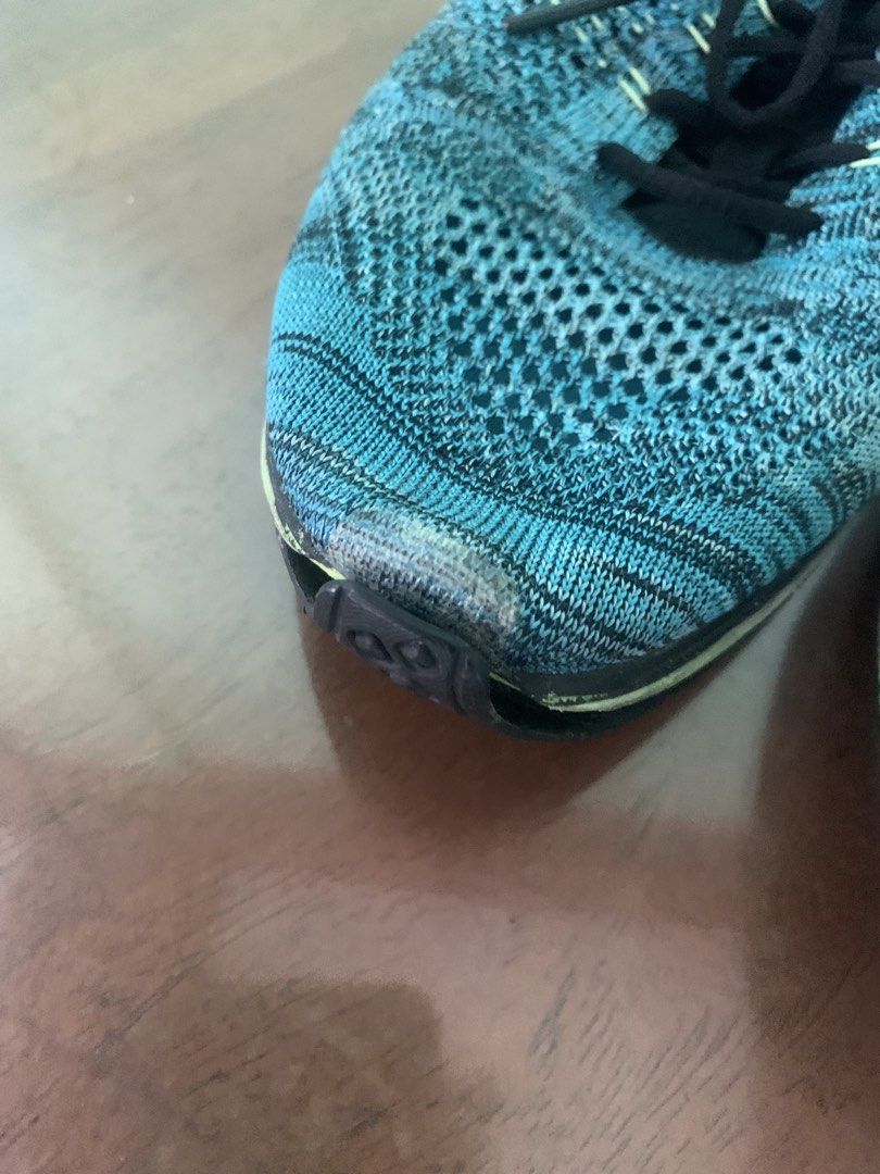 Nike Flyknit Racer Running Shoes (Category: Sneakers) located in Makati City. Submitted by ed_______ (Listing ID 1450687918, Image 3). Description: - Blue and black Nike Flyknit Racer shoes - Lightweight and breathable knit upper - Lace-up closure - Minor scuffing on toe area - Soles show wear but retain good grip - Ideal for running or casual wear - issue on the sold needs to be glued.