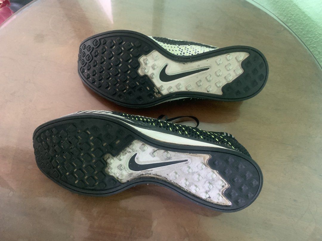 Nike Flyknit Racer Running Shoes (Category: Sneakers) located in Makati City. Submitted by ed_______ (Listing ID 1450688069, Image 3). Description: - Nike Flyknit Racer shoes - Color: Black, white, and neon yellow knit upper - Closure: Lace-up - Outsole: Rubber with good tread - Ideal for: Running or casual wear - Condition: Minor scuffs on soles from use - soles need to be glued.