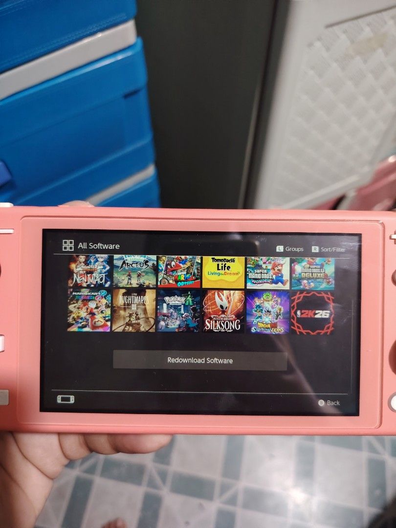 Nintendo Switch Lite Coral with Games (Category: Nintendo) located in Manila. Submitted by lemsgadgetszone (Listing ID 1450658657, Image 2). Description: - Coral Nintendo Switch Lite - Comes with pre-installed games: Animal Crossing, Zelda, Pokemon, and more! - Ready to play right out of the box - Ideal for gaming on the go - Screen is clear and all buttons are fully functional.