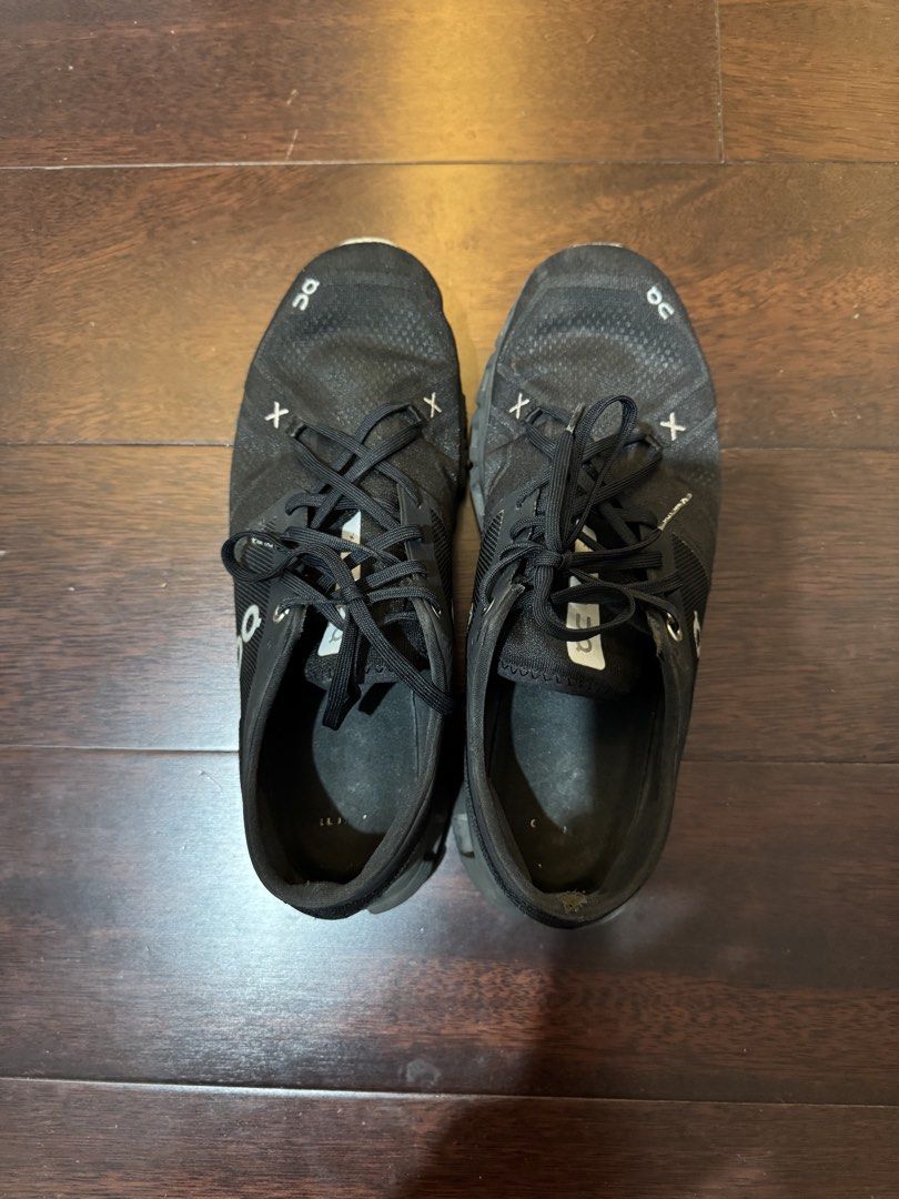 ON Cloud X Men Black Running Shoes US 10 (Category: Sneakers) located in Makati City. Submitted by patsang96 (Listing ID 1450631690, Image 2). Description: US 10 Bought in SM North Edsa 2022 Some cracking on the back right shoe.