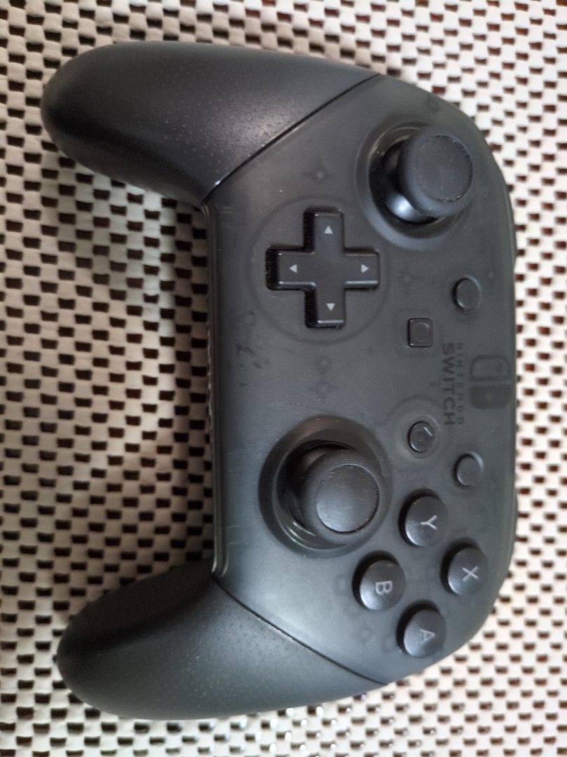 Original Switch Pro Controller (Category: Controllers) located in Singapore. Submitted by JoyconServicing (Listing ID 1450679369, Image 1). Description: - Nintendo Switch Pro Controller - Colour: Black - Fully functional - Minor scuffs from normal use - Perfect for Switch gaming.