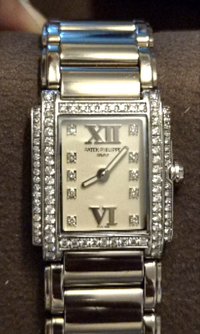 Patek Philippe Geneve Diamond Watch (Category: Luxury Watches) located in Santa Rosa. Submitted by traveljewelsnbags (Listing ID 1450729490, Image 1). Description: - Authentic Patek Philippe Geneve watch - Elegant rectangle face - Roman numeral hour markers - Sparkling diamond markers - Luxurious Two rowsdiamond bezel - 18 k solid gold - Comes with authenticity card - A truly great piece.