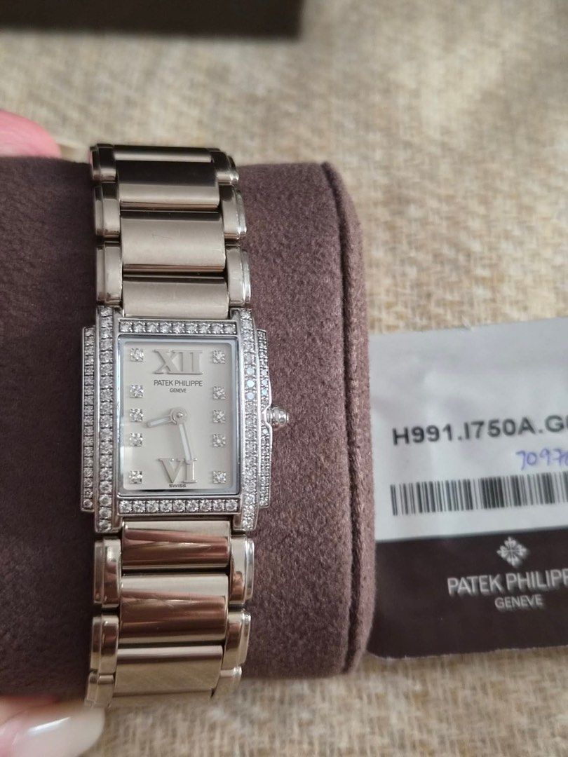 Patek Philippe Geneve Diamond Watch (Category: Luxury Watches) located in Santa Rosa. Submitted by traveljewelsnbags (Listing ID 1450729490, Image 2). Description: - Authentic Patek Philippe Geneve watch - Elegant rectangle face - Roman numeral hour markers - Sparkling diamond markers - Luxurious Two rowsdiamond bezel - 18 k solid gold - Comes with authenticity card - A truly great piece.