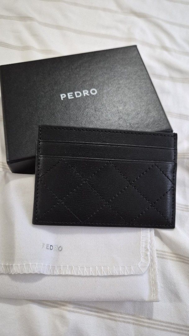 Pedro Black Quilted Card Holder with Box (Category: Wallets & Card holders) located in Pasig City. Submitted by colacloset (Listing ID 1450529314, Image 1). Description: - Brand: Pedro - Color: Black - Material: Quilted - Includes: Original box and dust bag - Features: Multiple card slots, gold Pedro logo on front - Benefits: Keeps cards organized, simple and sleek design Never used. brandnew! RFS: i only got this to get the bag doll that they ar