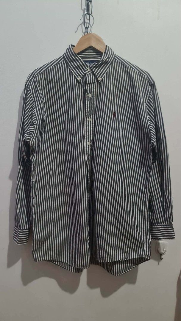 Polo Ralph Lauren Blake Striped Button-Down Shirt M (Category: Tshirts & Polo Shirts ) located in Tabaco. Submitted by emmanyul (Listing ID 1450529841, Image 3). Description: - Classic blue and white striped button-down shirt - No issues - 23x29 - Medium to Large sizing - Authentic - Brand: Polo Ralph Lauren - Fit: Blake - Material: 100% Cotton - Features: Embroidered Polo pony logo on chest - Size: Medium (M) - Versatile for smart casual or form