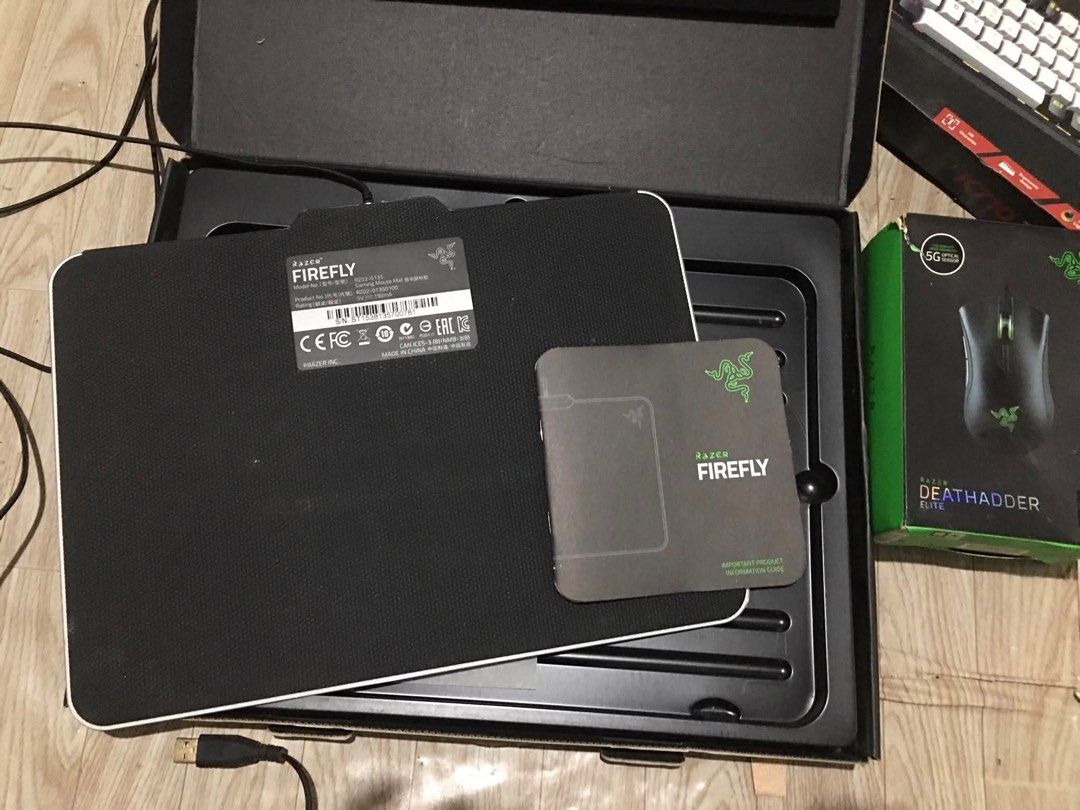 Razer Firefly Chroma RGB Gaming Mousepad (Category: Mouse & Mousepads) located in Talisay. Submitted by unscreamys07 (Listing ID 1450533265, Image 2). Description: Razer Firefly mousepad - Micro-textured surface for speed and control - Optimized for all sensitivity settings and sensors - Chroma customizable lighting - Includes original box and documentation - Perfect for gaming setups.