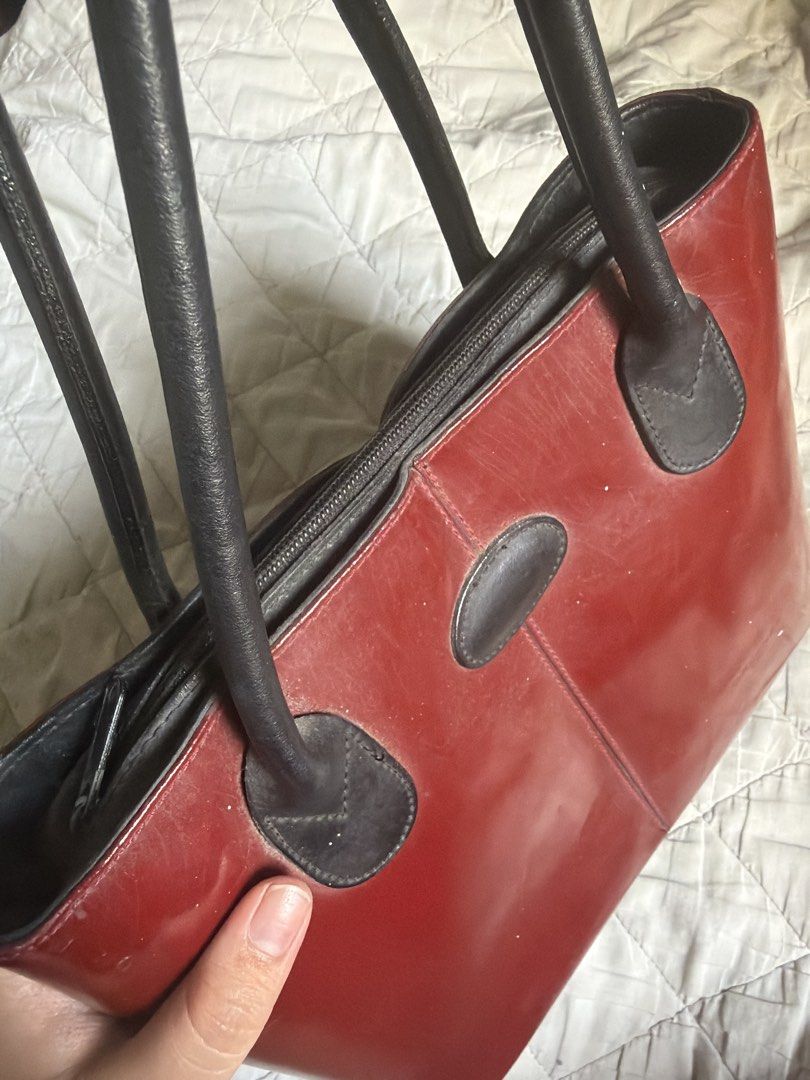 Red Leather Tote Bag (Category: Luxury Bags & Wallets) located in Caloocan City. Submitted by fuyaei (Listing ID 1450625368, Image 3). Description: - Classic red leather tote bag - Black handles and trim - Zipper closure - Minor scuffs on leather (expected with use) - Plenty of life left, great for everyday use - never used - lalamove or jnt (qc novaliches located) .