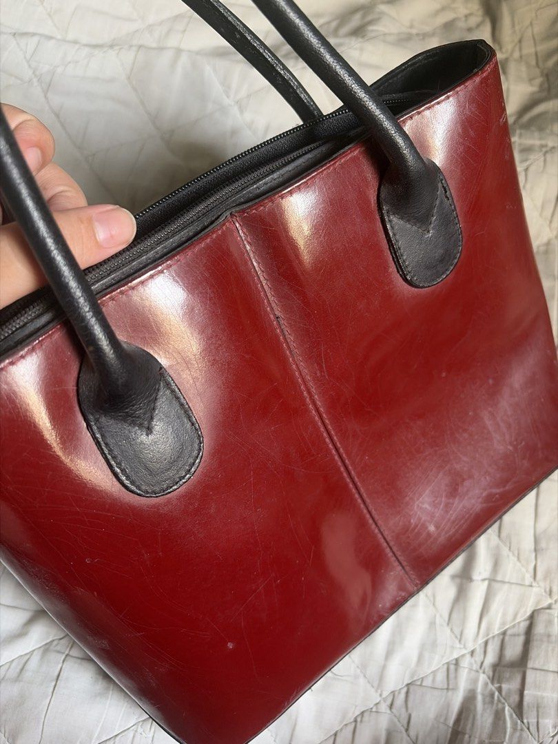 Red Leather Tote Bag (Category: Luxury Bags & Wallets) located in Caloocan City. Submitted by fuyaei (Listing ID 1450625368, Image 2). Description: - Classic red leather tote bag - Black handles and trim - Zipper closure - Minor scuffs on leather (expected with use) - Plenty of life left, great for everyday use - never used - lalamove or jnt (qc novaliches located) .