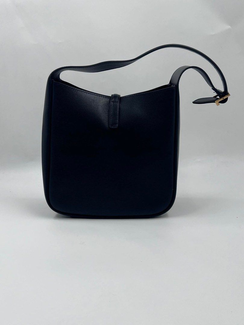 Saint Laurent Black Leather Hobo Bag (Category: Luxury Bags & Wallets) located in Malabon City. Submitted by truepenguin_22c2e4 (Listing ID 1450733877, Image 3). Description: - Saint Laurent hobo bag - Luxurious black leather - Iconic gold YSL logo hardware - Adjustable shoulder strap with buckle - Spacious interior for daily essentials - Timeless and versatile design .