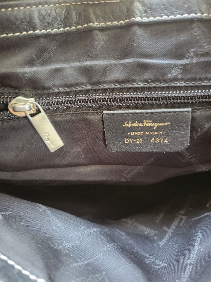 RUSH‼️Salvatore Ferragamo Hobo Bag (Category: Luxury Bags & Wallets) located in Iligan City. Submitted by kayluh (Listing ID 1450544472, Image 3). Description: - AUTHENTIC Salvatore Ferragamo Hobo Bag - Made in Italy - Color: Black - Iconic Gancini Clasp Detail - Zipper Closure - Interior with Salvatore Ferragamo Logo Lining - Model Number: DY-21 4374 - With Key Holder Inside ⚠️ WITH ISSUE, REFER AT PIC 7&8 kunin nyo na toh, need funds lngz.