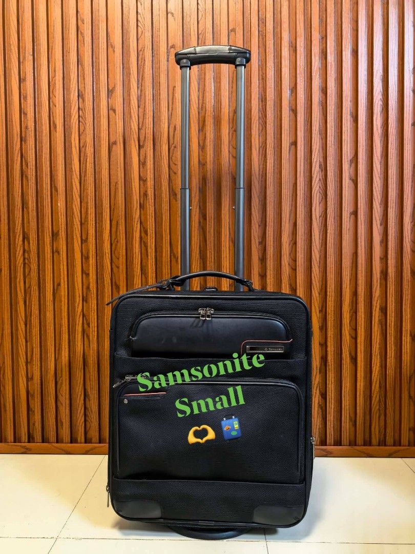 Samsonite Black Small Rolling Luggage Suitcase (Category: Luggage) located in Manila. Submitted by jzjapansurplus (Listing ID 1450702821, Image 1). Description: - Samsonite small rolling luggage - Classic black exterior with elegant leather trimming - Interior lined with signature Samsonite logo pattern - Retractable handle and smooth-rolling wheels for effortless transport - Multiple interior compartments for organized packing - Designed in Ital