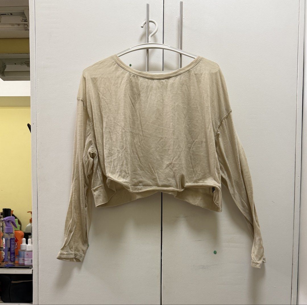 SHEIN Beige Long Sleeve Cropped Top Size M (Category: Longsleeves) located in Manila. Submitted by kzfsss (Listing ID 1450650401, Image 1). Description: - SHEIN beige long sleeve cropped top - Lightweight material, ideal for layering - Features a trendy raw hem detail - Versatile piece, pairs well with jeans or skirts - Offers a comfortable fit.