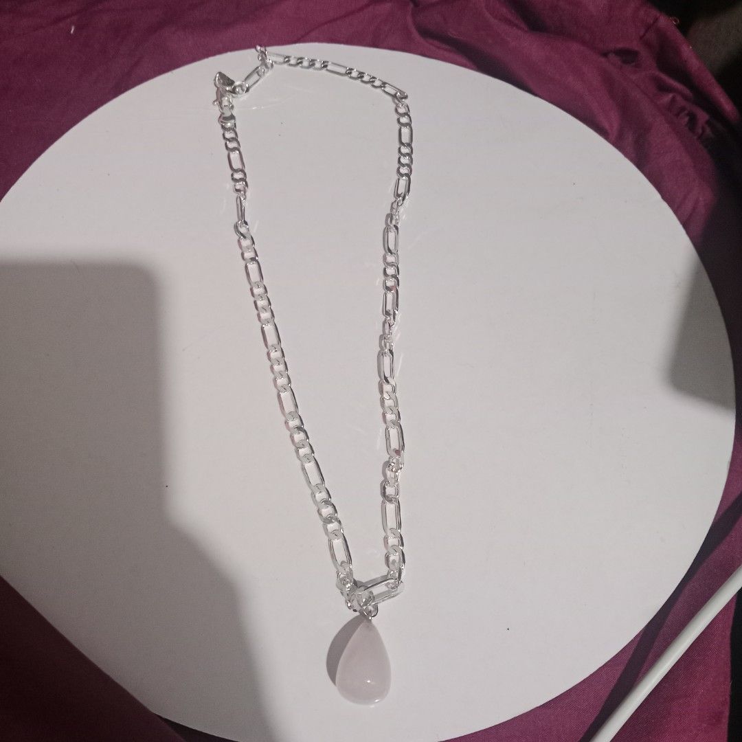 Silver Chain Necklace with Rose Quartz Pendant (Category: Necklaces) located in Manila. Submitted by slgrld (Listing ID 1450549224, Image 2). Description: - 925 Sterling Silver chain necklace choker - Teardrop-shaped rose quartz pendant - Figaro link chain design - Simple and pretty style - Versatile for everyday wear or dressing up - Matches with most outfits.