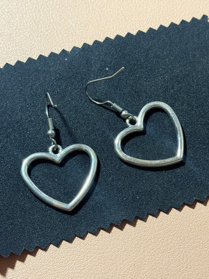 Silver Stainless Steel Heart Dangle Earrings (Category: Earrings) located in Manila. Submitted by thriftchic__ (Listing ID 1450631880, Image 2). Description: - Cute silver heart-shaped earrings - Simple and classic design - Great for everyday wear - Lightweight and comfortable - Easy to put on and take off - Silver stainless steel.