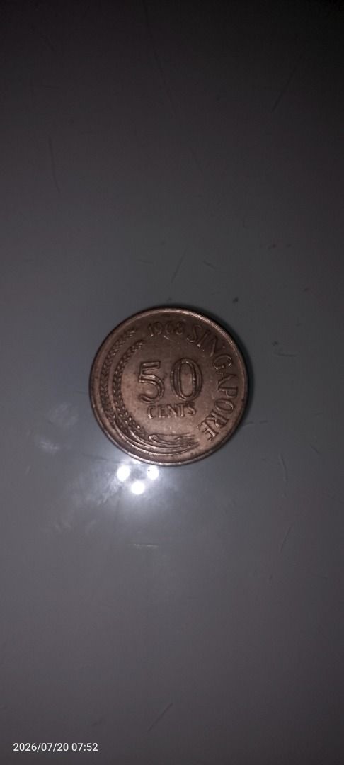 Singapore 50 Cents Coin (Category: Currency) located in Caloocan City. Submitted by carylpangi13052 (Listing ID 1450735672, Image 1). Description: - Singapore 50 cents coin - Year: 1968 - Features a lionfish design - Inscription: '50 CENTS SINGAPORE' - Ideal for coin collectors and numismatists.